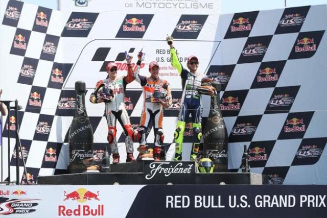 Il podio della MotoGP con Marquez tra Bradl e Rossi