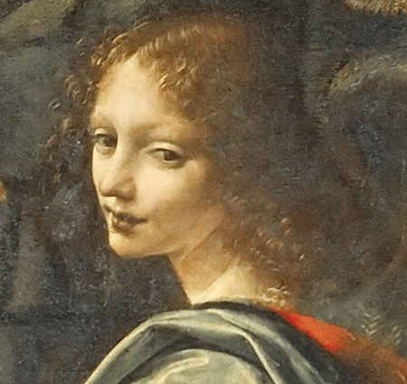Dettaglio volto dell'angelo de La Vergine delle Rocce di Leonardo al Louvre
